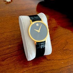 Gold/Black Movado museum watch.
